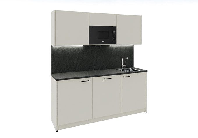 A white kitchenette with a slate countertop and stylish accents, serving as a modern office kitchenette